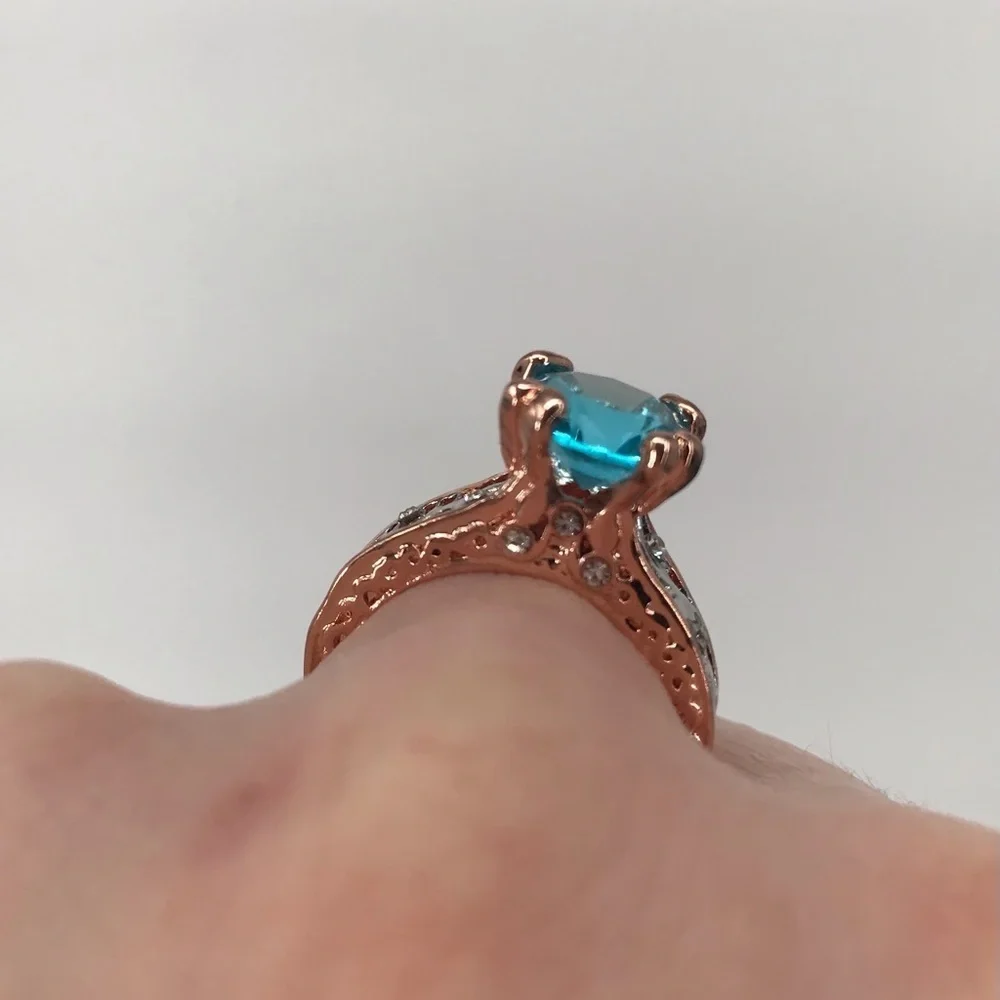 Mixed Metal Solitaire Ring with Blue Stone